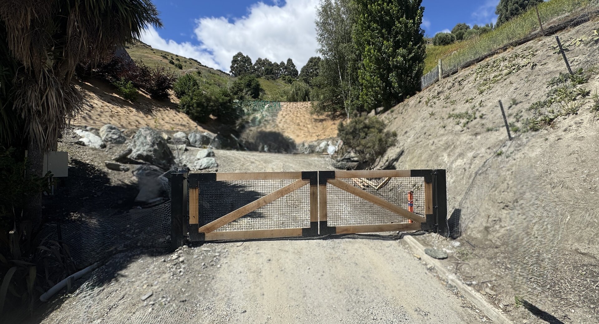 The original gates — expensive, automated, and announcing the property